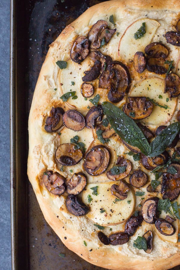 Apple, Sage, & Mushroom Pizza with Vegan Ricotta: A smoky, salty, sweet, and savory pizza perfect for fall! Topped with smoked paprika mushrooms, sweet apple, fried sage, and vegan ricotta! || fooduzzi.com recipe