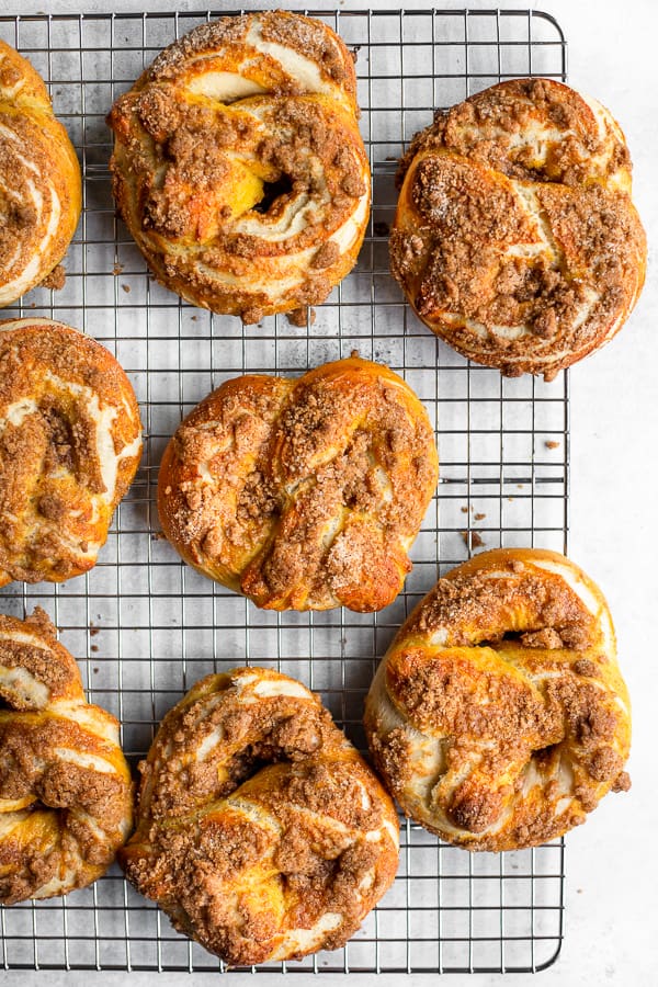 baked cinnamon crunch soft pretzels on a cooling rack