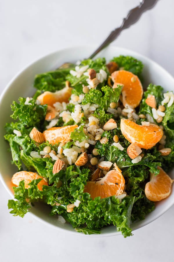 Bean, Kale, and Grain Bowl with Mandarin Dressing: a simple and satisfying 5-minute meal that's gluten free, vegan, healthy, and completely customizable! Mix and match to create your personalized bowl! || fooduzzi.com recipes