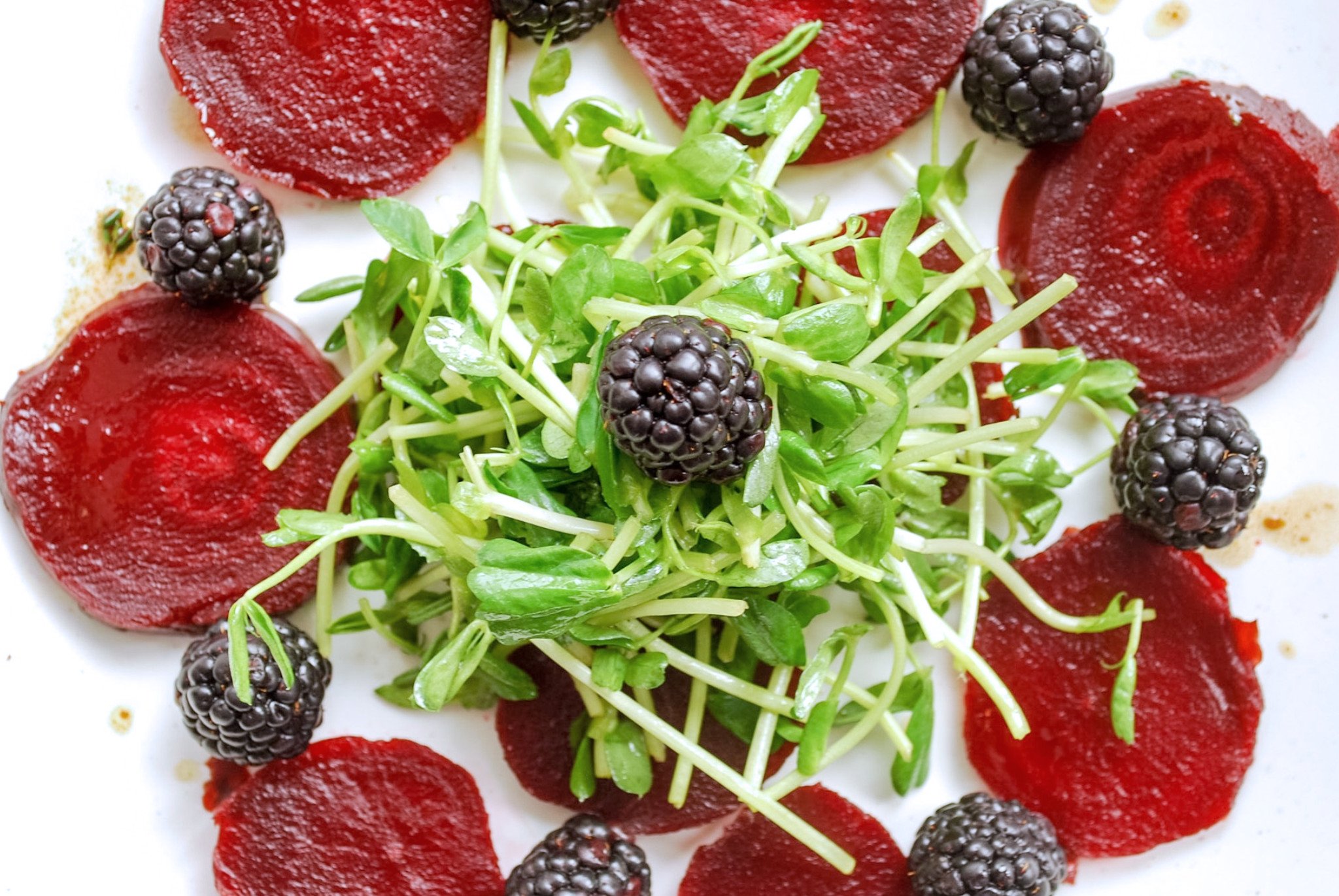 Beet Carpaccio: Beautiful beets accented with tangy blackberries and aromatic thyme. This gluten free and vegan appetizer is sure to impress! || fooduzzi.com
