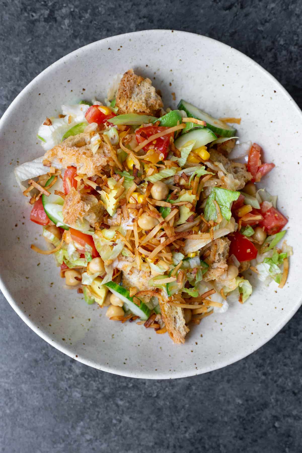 A vegan panzanella salad in a light bowl