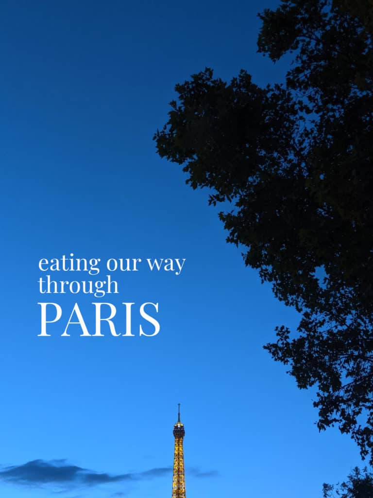 the tip of the Eiffel Tower against the night sky