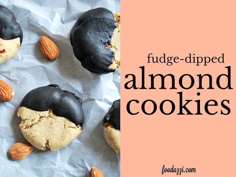 Fudge-Dipped Almond Cookies: Perfect little almond cookies dipped into a homemade fudge sauce. Best of all, they're gluten free, vegan, dairy free, healthy, and perfect for Christmas Cookie extravaganzas! || fooduzzi.com recipes