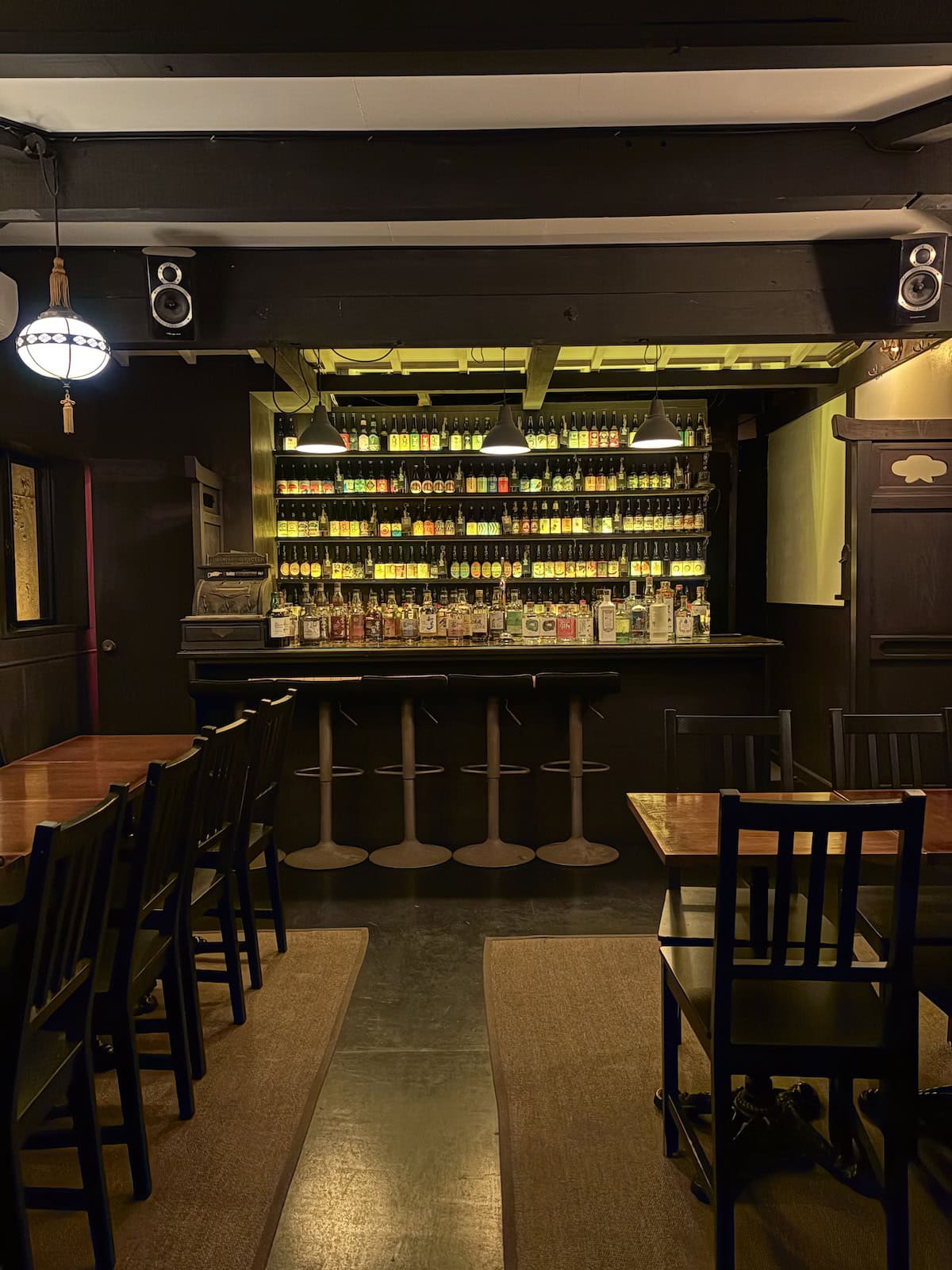 The Kawa Bar in Kyoto showing a wall of beer bottles