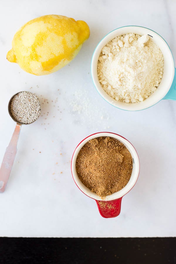 Chewy Lemon Cookies with Coconut Icing and Pistachios: a healthy, gluten free, and vegan cookie that's incredibly chewy and full of fresh flavors! This recipe is refined sugar-free! || fooduzzi.com recipe