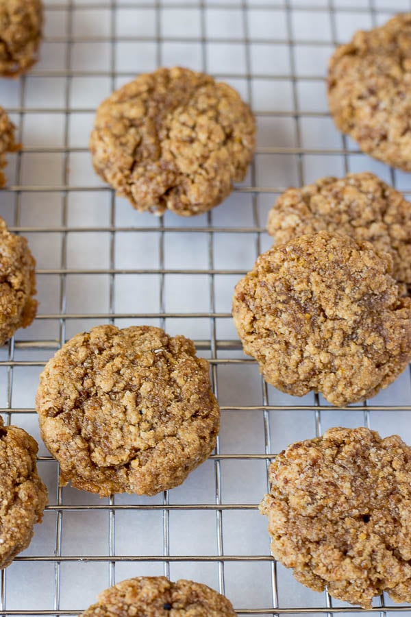 Chewy Lemon Cookies with Coconut Icing and Pistachios: a healthy, gluten free, and vegan cookie that's incredibly chewy and full of fresh flavors! This recipe is refined sugar-free! || fooduzzi.com recipe