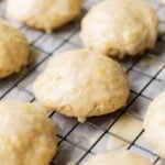 a close-up of a glazed lemon loaf cookie on a cooling rack
