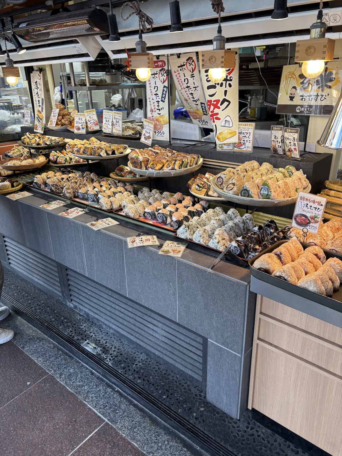 The Onimaru Yaki Musubi stand in Kyoto with loads of onigiri displayed