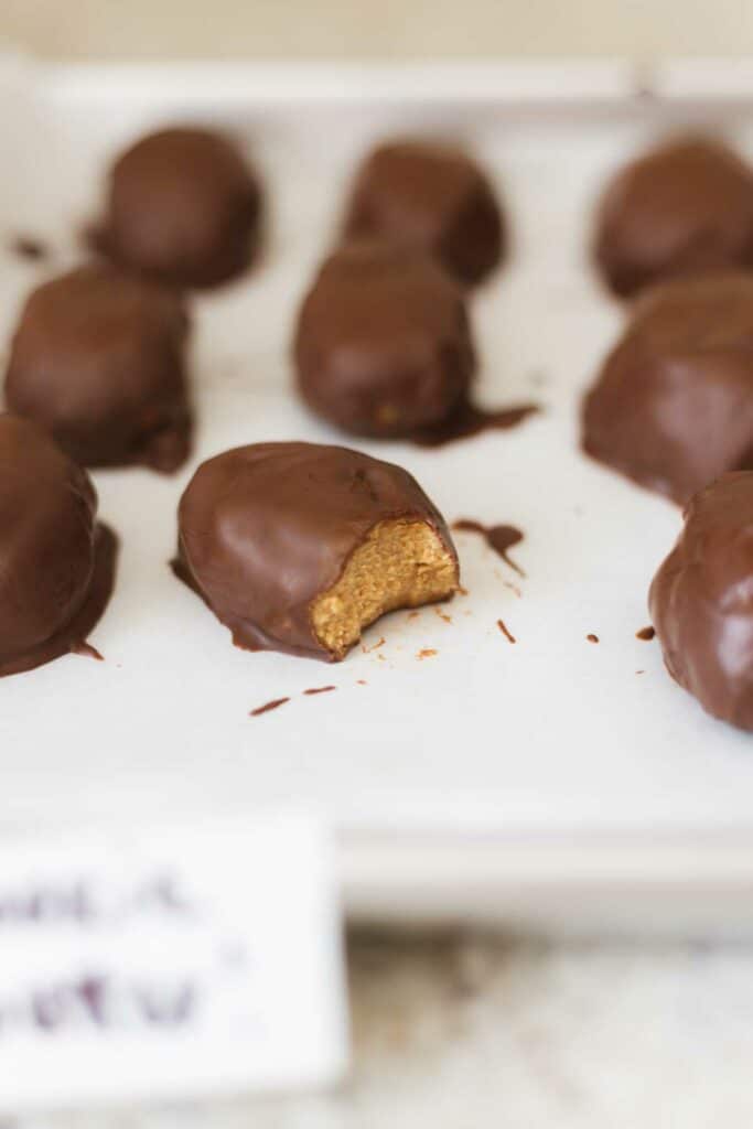 a bite taken out of a vegan cookie butter egg