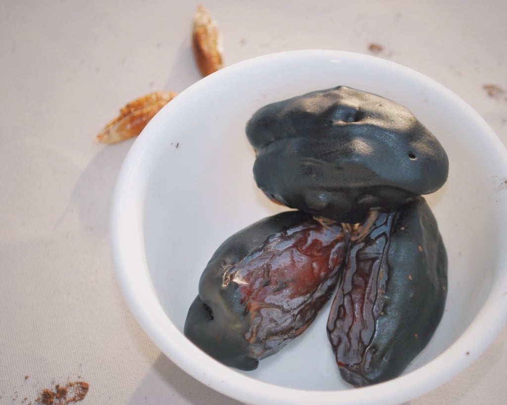 Chocolate-Dipped Nut-Stuffed Dates - a healthy and scrumptious treat that won't undo your NYE goals! || fooduzzi.com