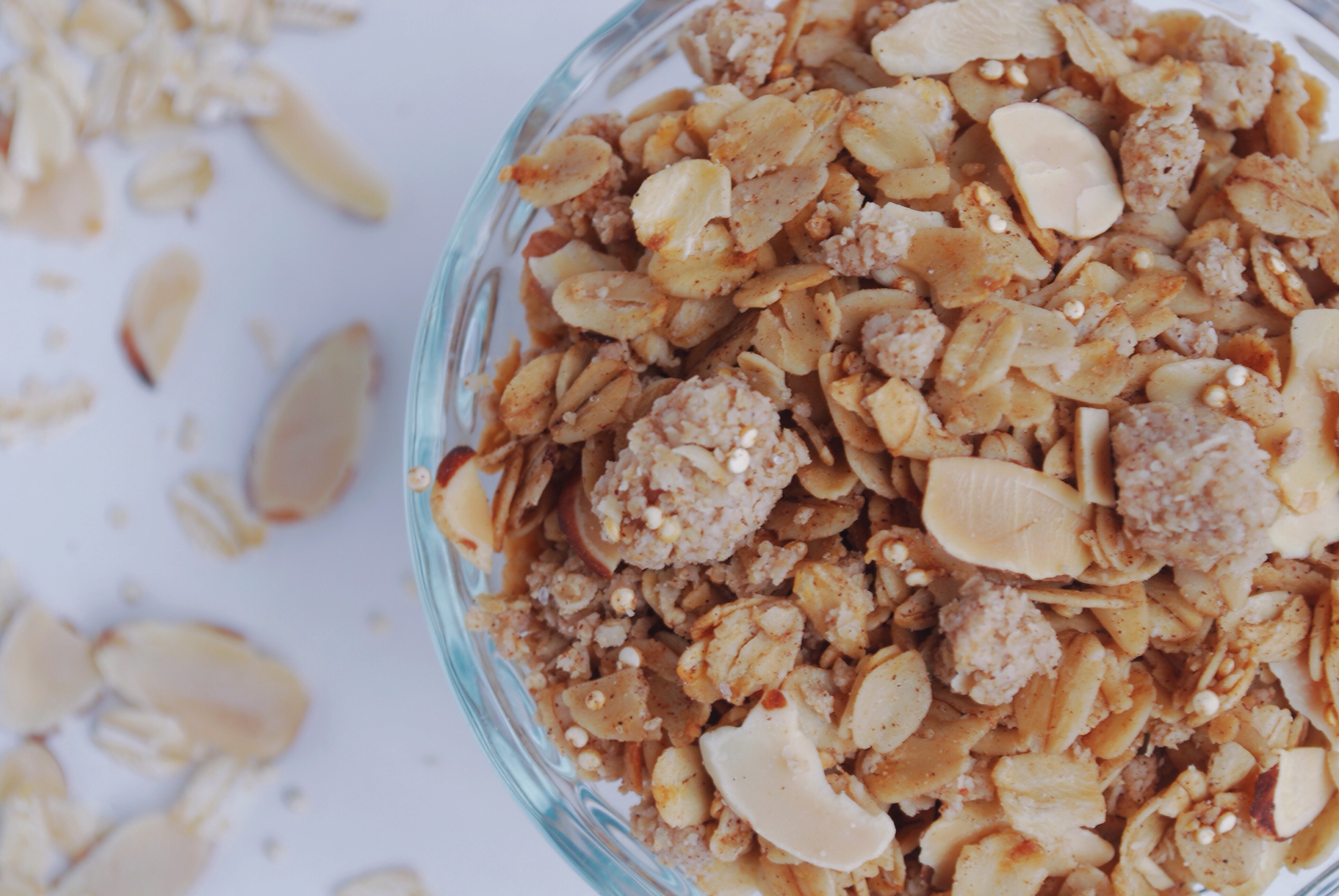 Coconut Coffee Cake Granola: Your house will smell like a buttery rich dessert as you pull the pan of this Coconut Coffee Cake Granola from the oven, when it's really full of fiber, nutrients, and protein! This naturally gluten free and vegan mix will satisfy that summertime yearning! || fooduzzi.com