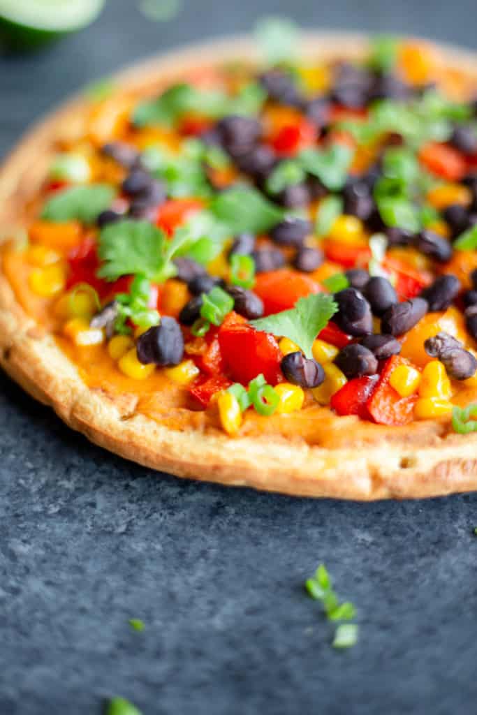 a close-up of a smoky bell pepper corn flatbread