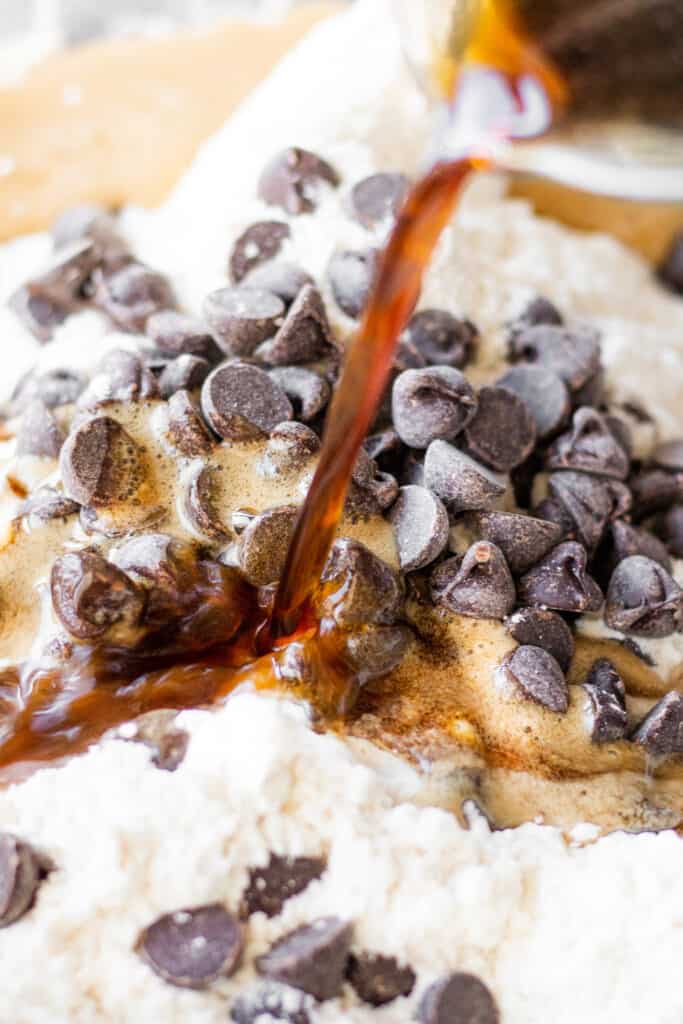 stout pouring on top of chocolate chips for a stout chocolate chip soda bread
