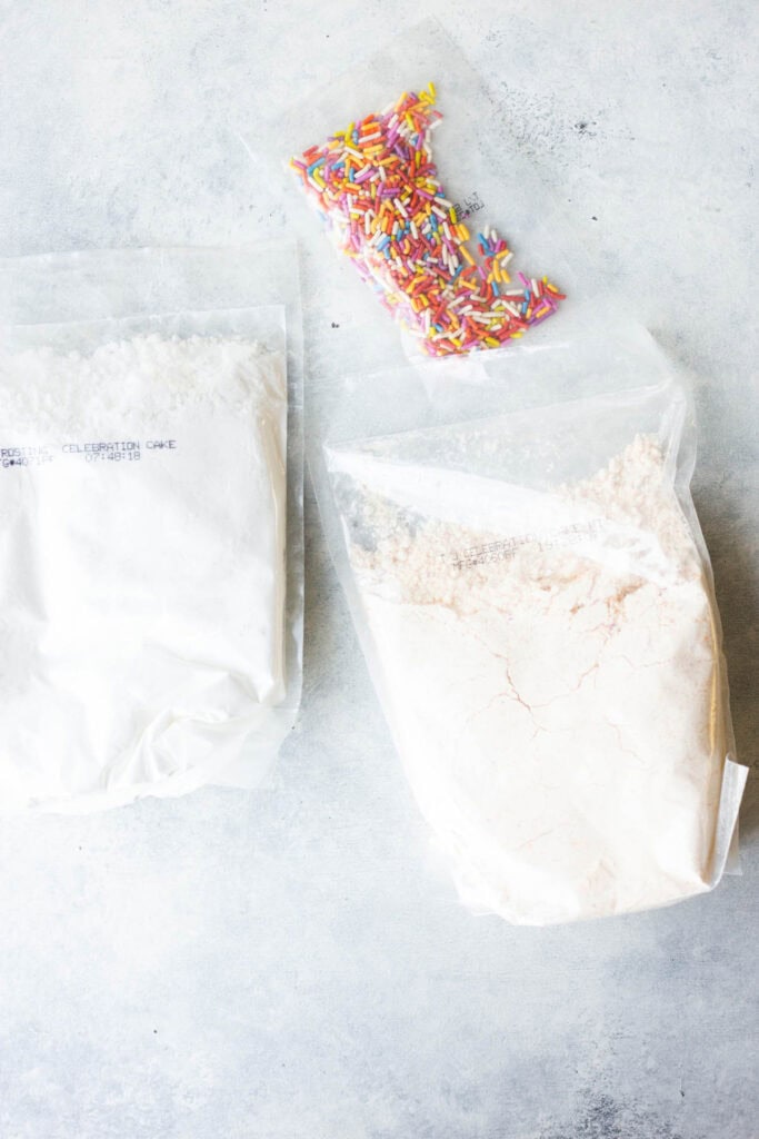 Trader Joe's Celebration Cake and Baking Mix box ingredients on a white background