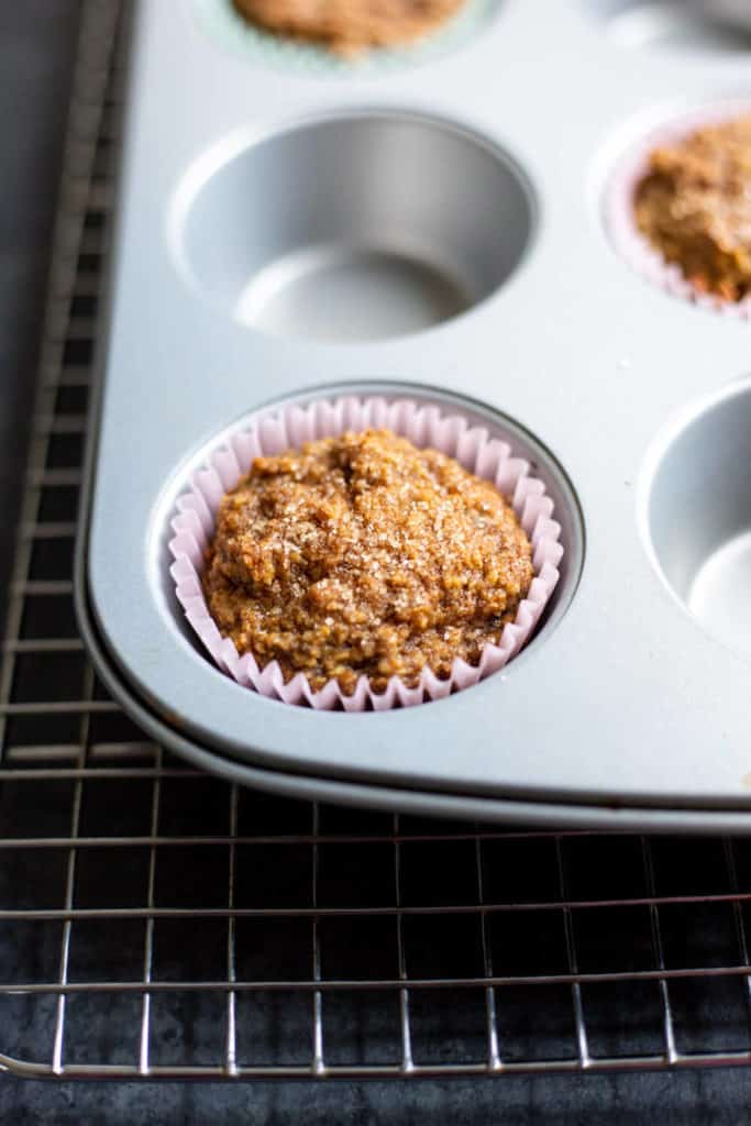 a Vegan Blender Apple Spice Muffin in a muffin tin