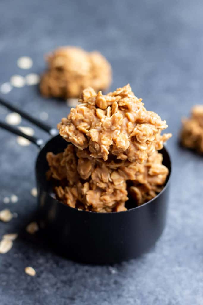 vegan cookie butter no bake cookies in a black measuring cup