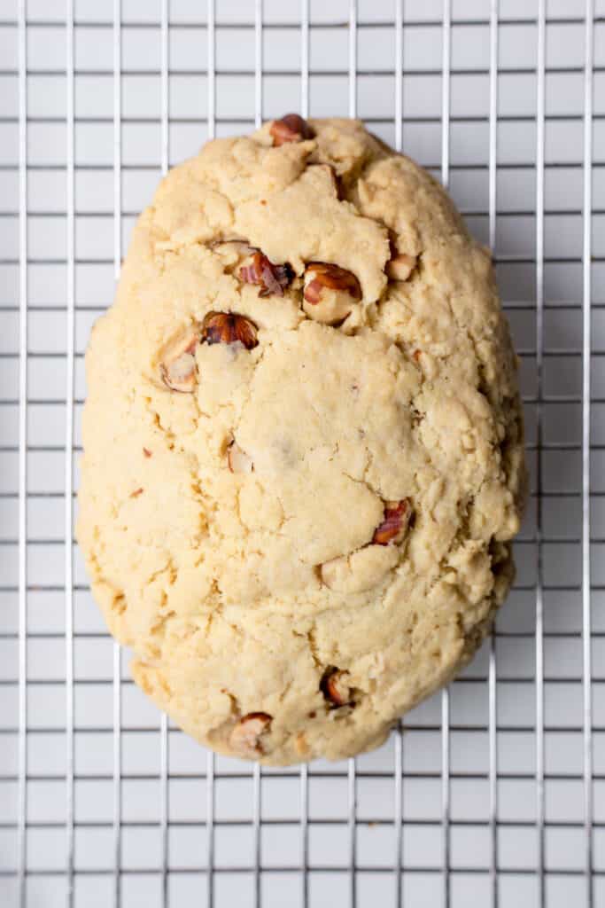 a pre-cut biscotti log on a cooling rack