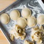uncooked vegan homemade pasta on a cookie sheet