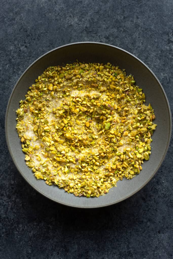 a pistachio, sugar, lemon zest filling for lemon pistachio sweet rolls in a bowl