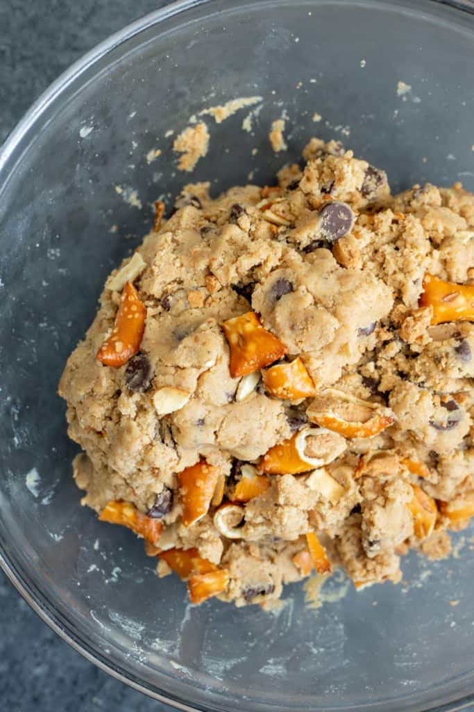a bowl of vegan peanut butter pretzel chocolate chip cookie dough