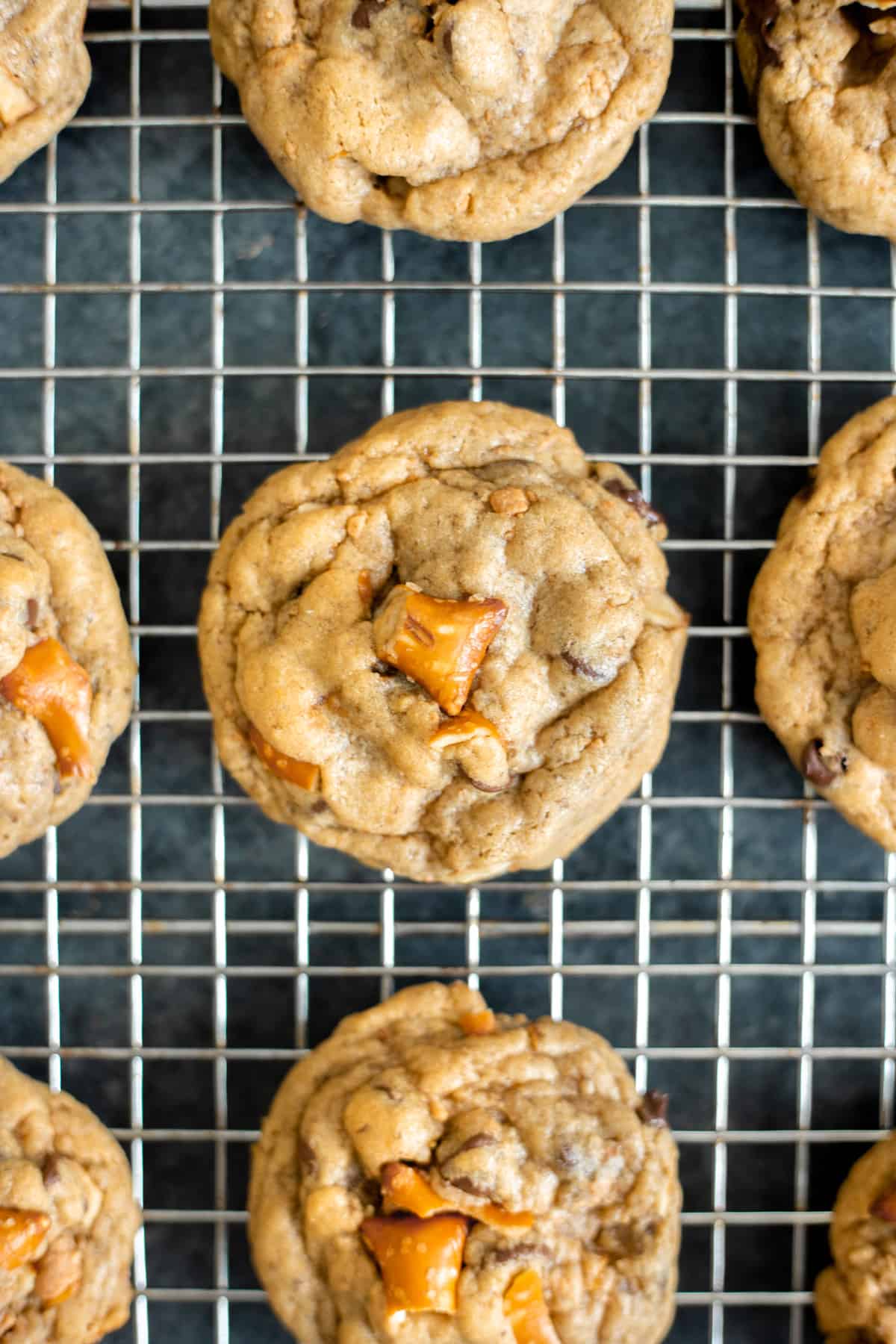 vegan peanut butter pretzel chocolate chip cookies on a cooling rack