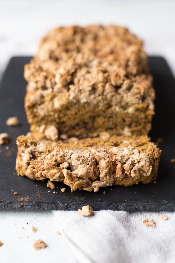 Vegan Pumpkin Coffee Cake: A simple coffee cake with a fall twist! Naturally gluten free and vegan, made with minimal sugar, and topped with an addictive streusel! || fooduzzi.com recipe