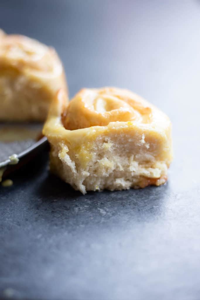 A close-up of a single Vegan Strawberry Lemon Sweet Roll