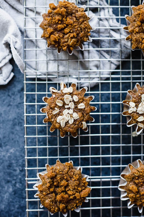 Whole Wheat Vegan Oatmeal Raisin Muffins: If you're an oatmeal raisin cookie fan, you'll LOVE this muffiny take on them! These muffins are whole wheat, naturally vegan, and so simple to make! Perfect for breakfast, snacks, or dessert. || fooduzzi.com recipe #vegan #veganmuffins #muffins #oatmeal