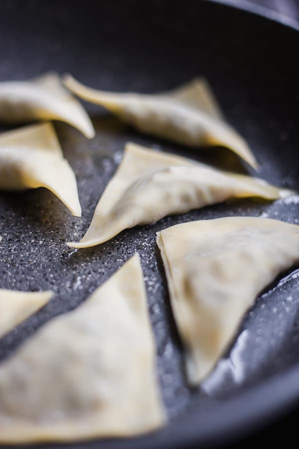 potstickers cooking in a pan