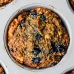 a Vegan Blueberry Walnut Oatmeal Muffin in a muffin pan