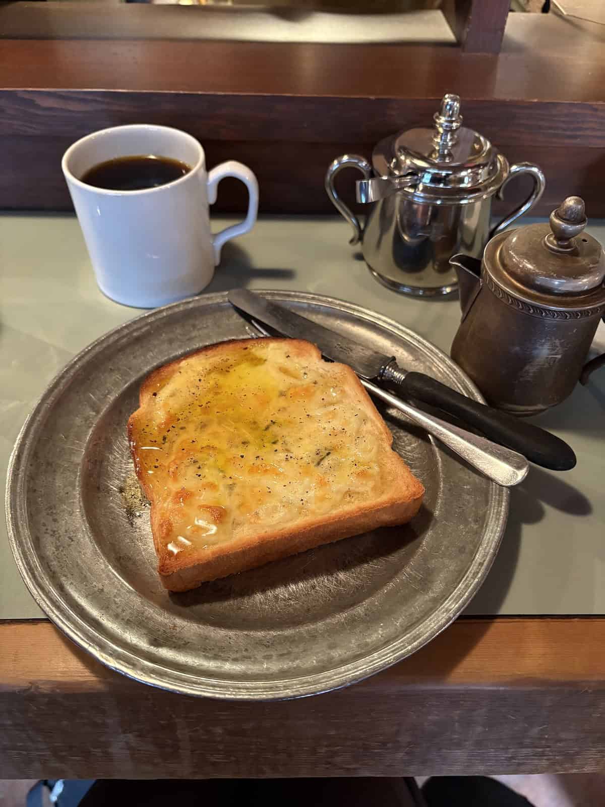 The cheese and honey toast and a cup of black coffee at Wife + Husband